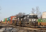 NS 8115 leads a long cut of cars out of the yard